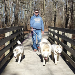 Three pups with Rob on bridge